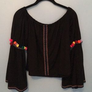 Fun flowy bright pom pom sleeve top